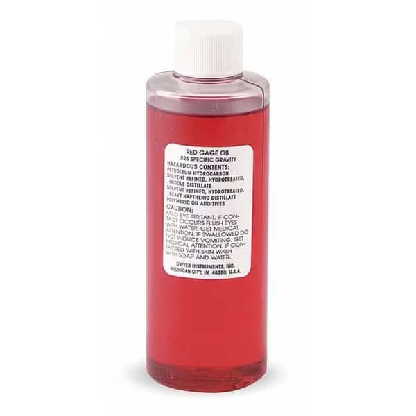 4 oz bottle of red gage fluid, .826 sp. gr.